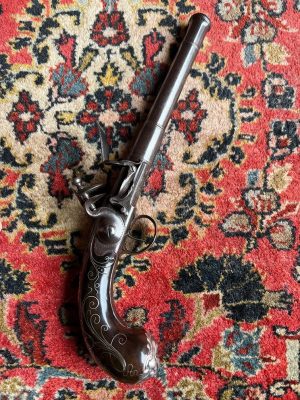 A Fine and Early Silver Mounted "Queen Anne" Style Pistol by John Mayo